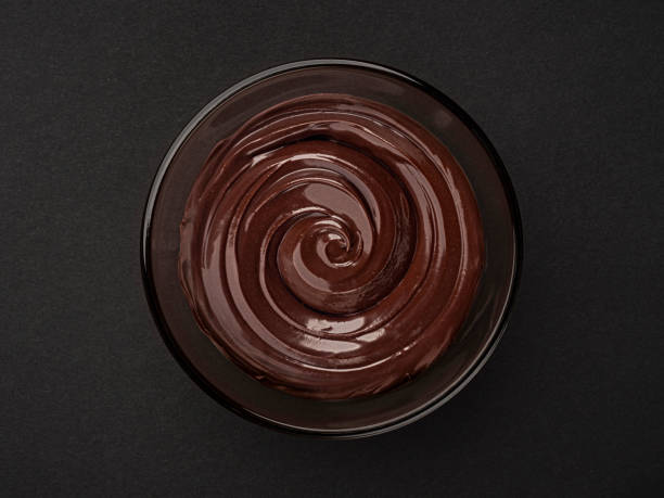 istock Chocolate cream swirl on black background with copy space, top view 2179157972