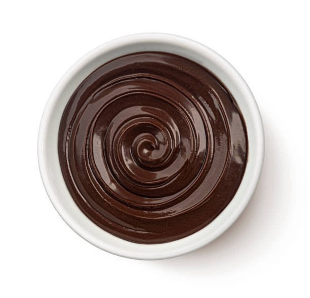 istock Melted chocolate cream swirl isolated on white background, top view 2179157979