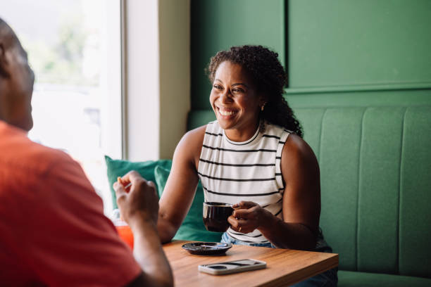 istock Black woman smiling and having fun in a cafe 2179160912