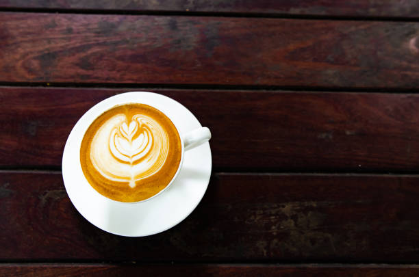 Latte Coffee on a Wooden Table A Warm Morning Moment