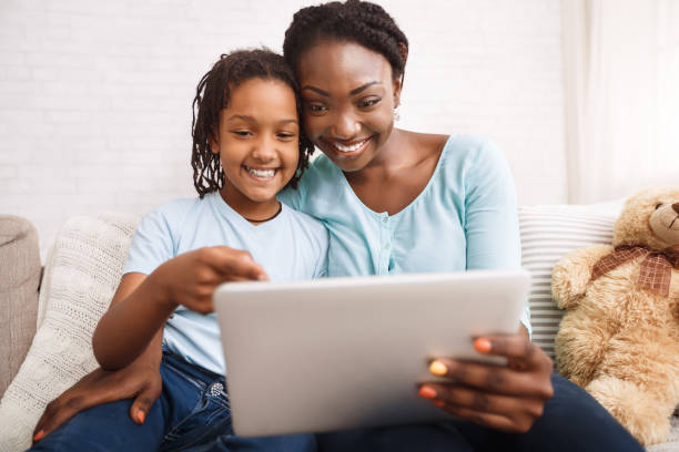istock Afro mom and daughter making video call 2179161825