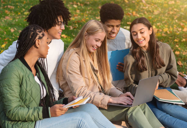 istock Group of international students studying at autumn park 2179166999