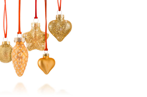Set of various gold Christmas ornaments including star, heart, pinecone, and traditional round shapes, all hanging from red ribbons. These glittering and shiny decorations bring an elegant and festive touch to holiday décor.