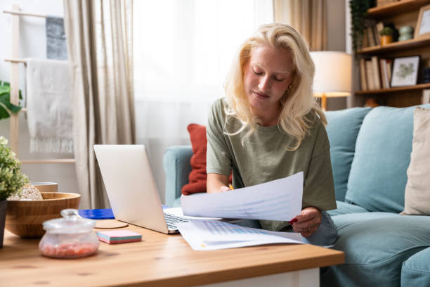 istock Serious concentrated pensive woman using laptop computer work from home office, communicating online, distantly working or studying for exam. Young freelance business person calculating data as job. 2179168185