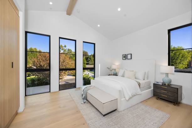 istock Modern bedroom with large windows and cozy decor. 2179169869