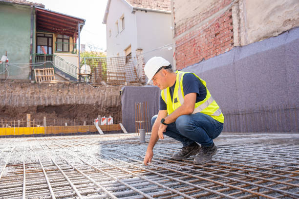 istock A worker in protective gear inspects a network of steel gratings installed at a construction site 2179170239