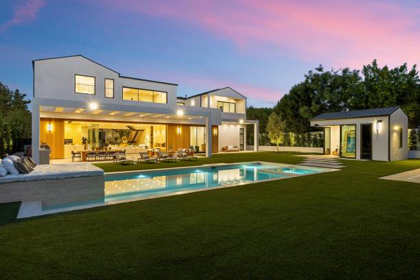 istock Luxury modern home with pool at dusk. 2179170274