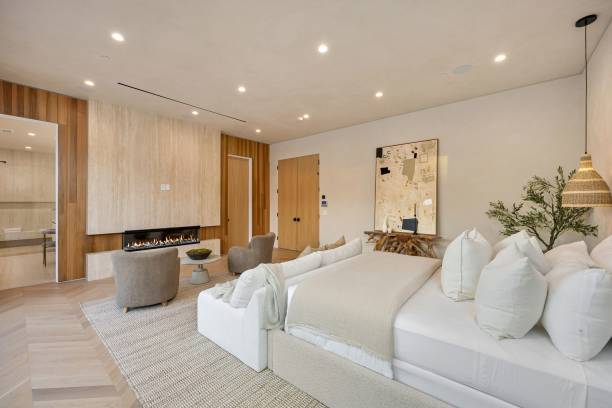 istock Modern luxury bedroom with stylish decor and fireplace. 2179171042