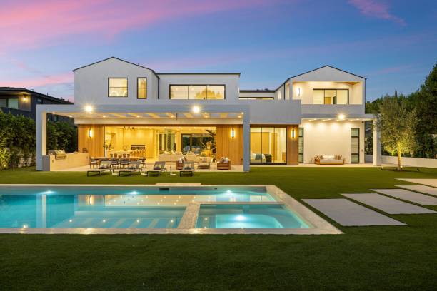 istock Modern luxury home with pool at sunset. 2179171045