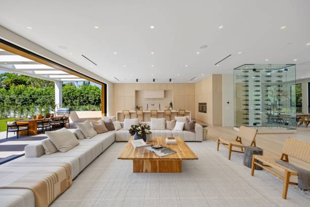 istock Modern open-plan living room with outdoor dining area. 2179171325