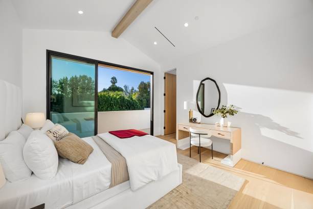 istock Modern bedroom with minimalist decor and greenery view. 2179171513