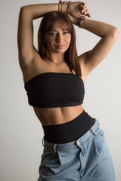 istock Effortless allure in denim and a sleek black top, the ultimate studio shot 2179171628