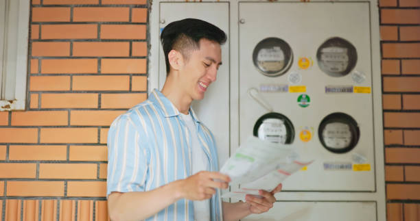 istock Asia man satisfied save electricity 2179173725