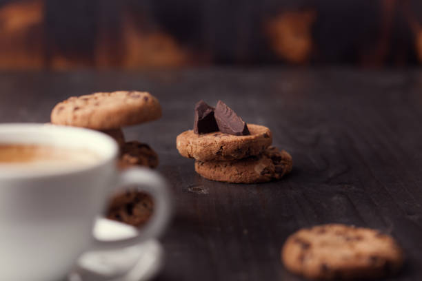 istock Coffee cup with chocolate cookies on dark old wooden table 2179174967