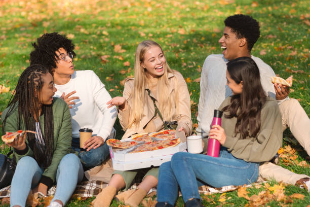 istock Delighted teenagers spending weekend in autumn forest 2179176034