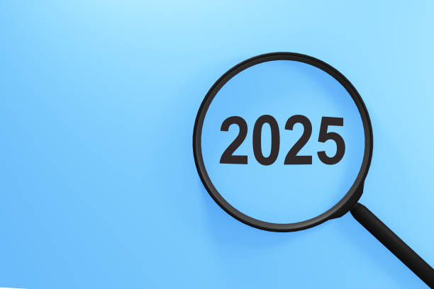 istock Exploring New Year 2025 Celebration Concepts With a Magnifying Glass on a Light Blue Background 2179179166