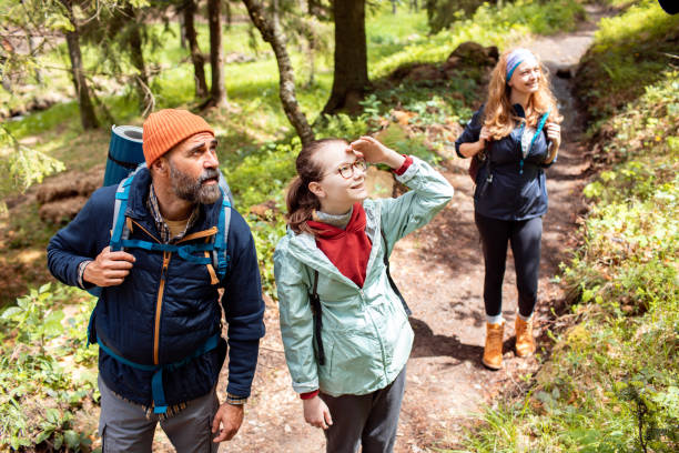 istock Young family hiking in a forest 2179184407