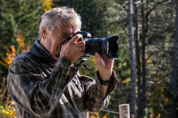 istock Senior photographer in Autumn 2179184480