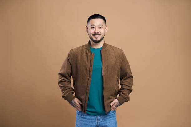 istock Young man smiling with hands in pockets is feeling confident 2179185971
