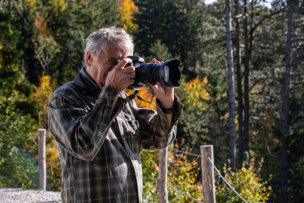 istock Senior photographer in Autumn 2179186721