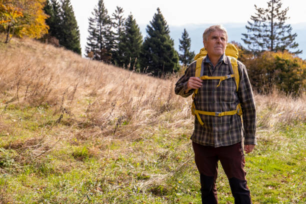 istock Senior man hiking in the autumn mountains 2179192399