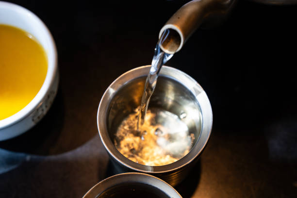 istock pouring water from kettle to cup 2179195666