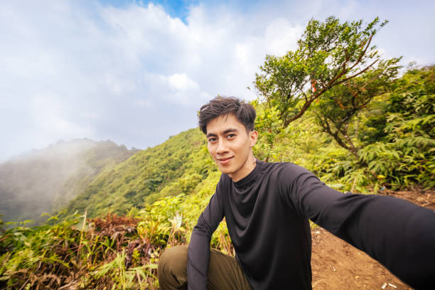 istock Explorer at the Peak, Capturing the Moment. Immersive View from Mountain Top. 2179195953