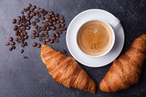 istock Top view of coffee and croissant with coffee beans 2179196615