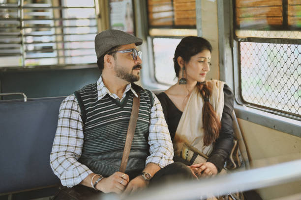 istock Couple sitting by the window in a train, looking outside 2179196678