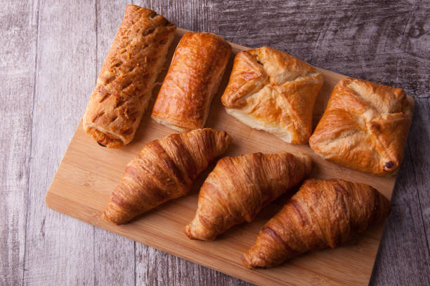 istock An assortment of freshly baked pastry aligned on cutting board 2179197609