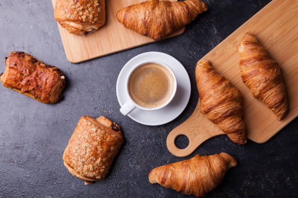 istock Assortment of pastries with coffee cup on wooden table background 2179198004