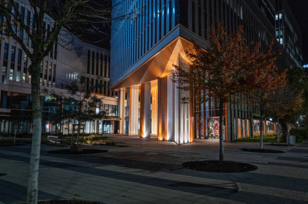 istock Modern Office Building Lit at Night With Urban Architecture, Wroclaw Poland 2179201876