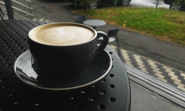 istock cup of cappuccino on a rainy day 2179205085