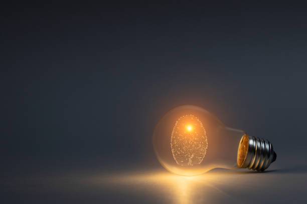 istock Digital security concept with person identity fingerprint with classic light bulb 2179207709
