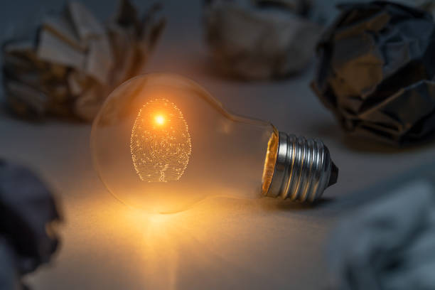 istock Digital security concept with person identity fingerprint with classic light bulb 2179208312