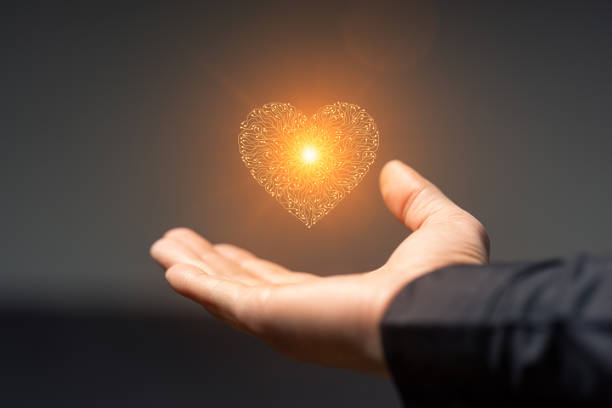 istock Artificial intelligence Circuit board heart symbol in mens hands on dark background 2179208848