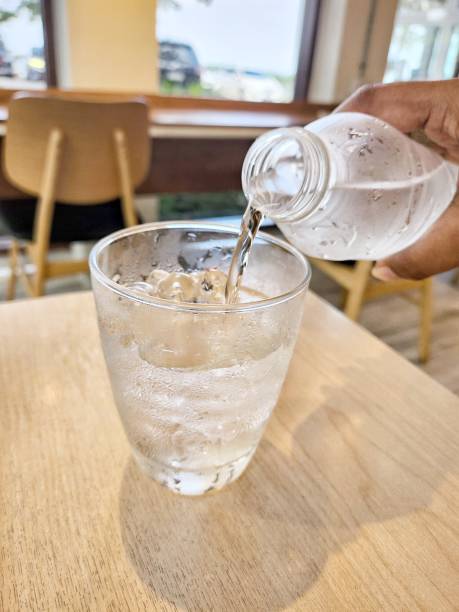 istock Pouring drinking water in a glass 2179214555