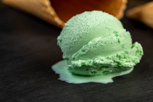 istock green ice cream with mint flavor on a black slate surface 2179219975