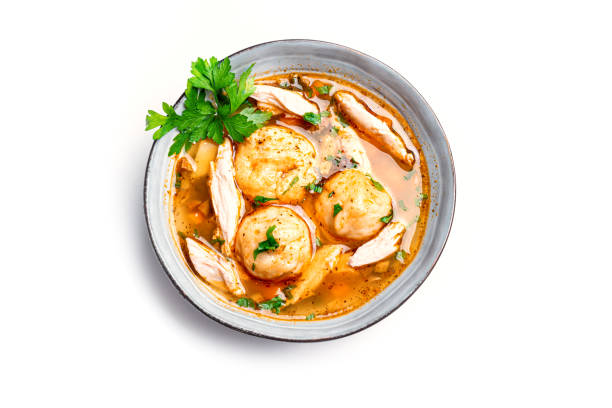 Matzoh ball and chicken soup Matzoh ball soup isolated on white background, top view. Jewish israeli cuisine, homemade Matzo Ball soup with chicken and vegetables. kosher starter recipes stock pictures, royalty-free photos & images