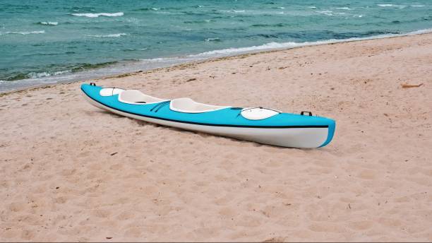 istock Kayak Canoe Parked on Seashore Beach Sand 2179222576