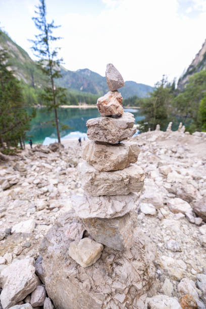 istock Balanced Rock Cairn by Alpine Lake in Mountain Setting 2179223097