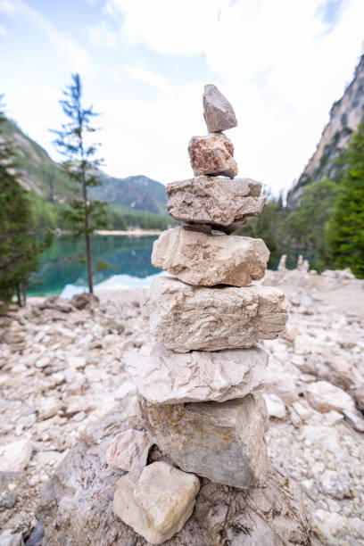 istock Stacked pebbles by an alpine lake 2179223365