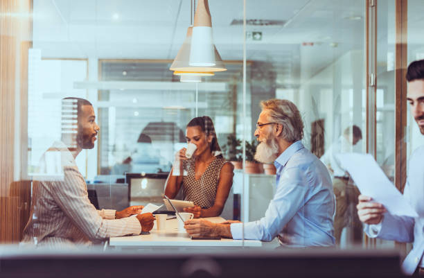 istock Diverse Executives Engage in Strategic Planning in Modern Conference Room 2179226644