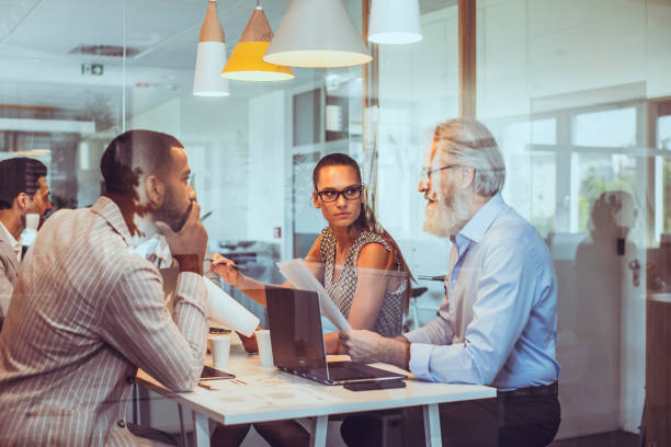 istock Diverse Business Team Engages in Strategy Session in Modern Office 2179226684
