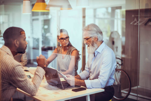 istock Diverse Executives in Strategic Meeting at Modern Office 2179226704