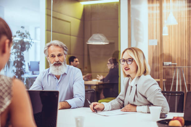 istock Diverse Business Executives Collaborating in a Modern Office Space 2179227247
