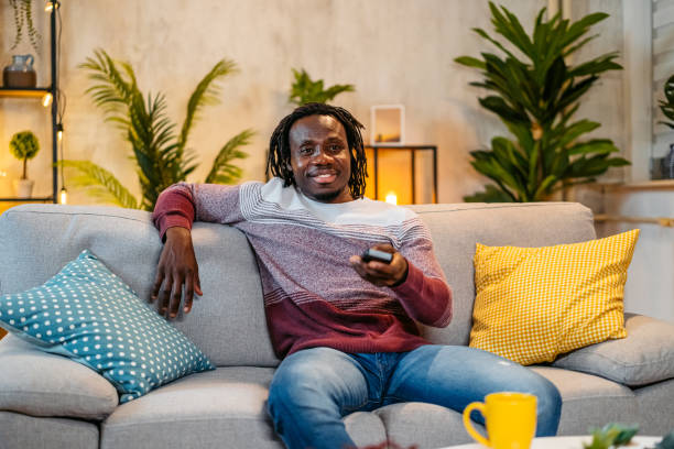 istock Young Man Watching TV At Home At Night 2179228547