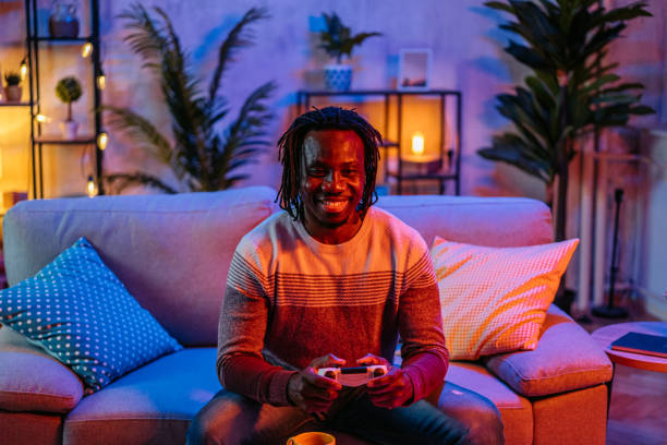 istock Young Man Playing Video Games At Home At Night 2179231176