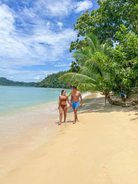 istock Couple Walking on a Tropical Beach 2179231281