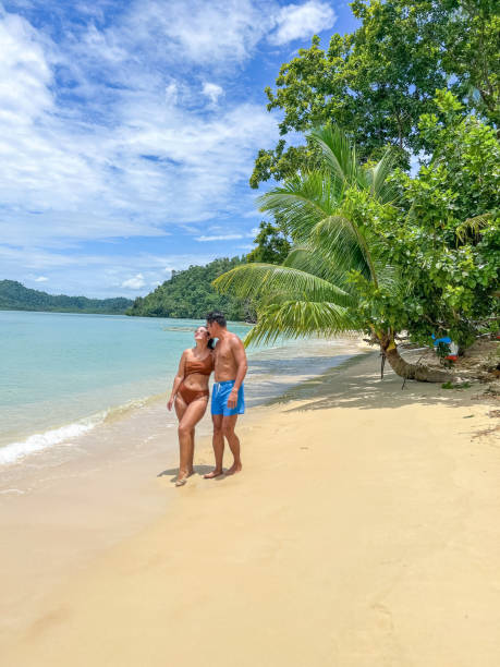 istock Couple Walking on a Tropical Beach 2179231480